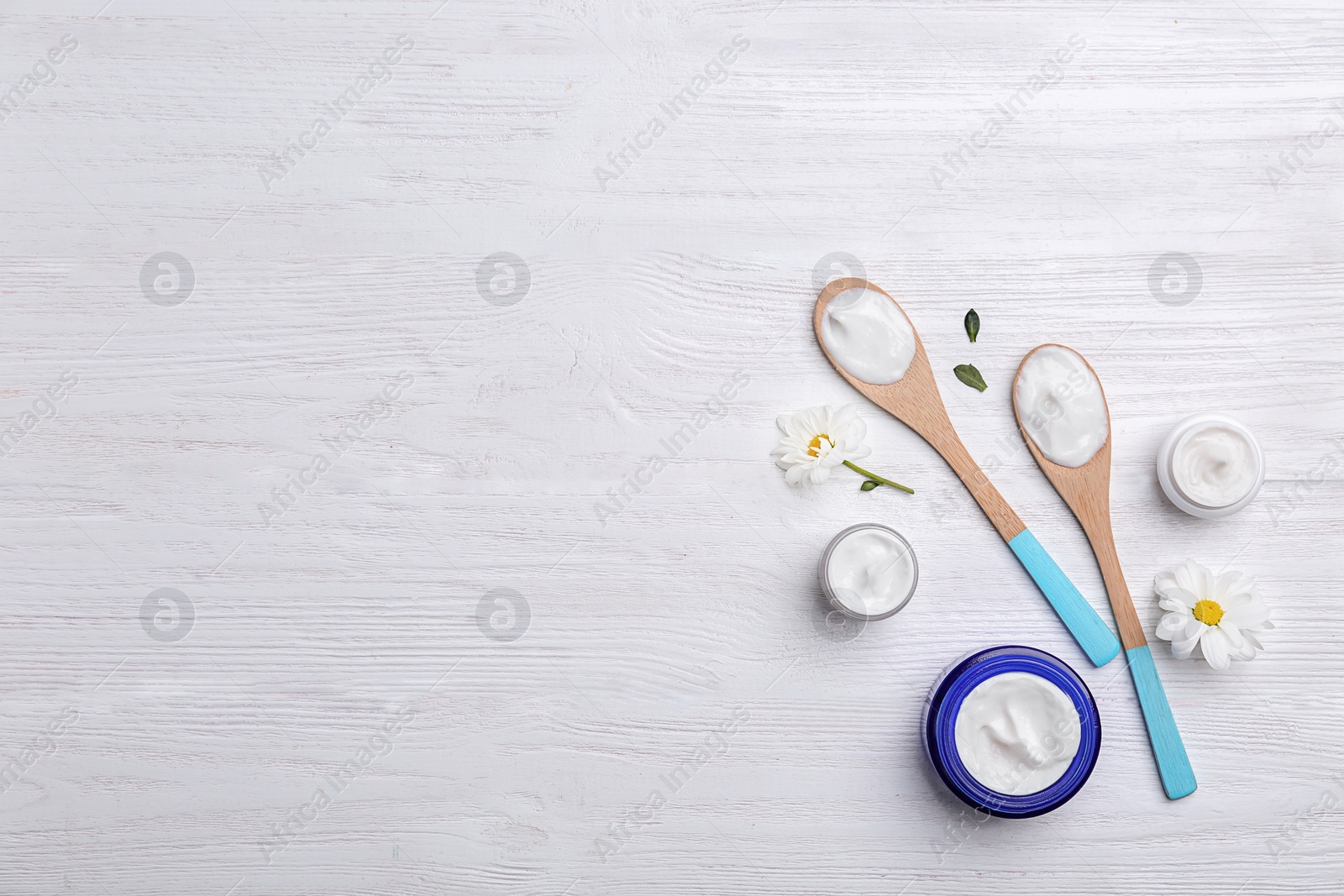 Photo of Composition with body cream on wooden background