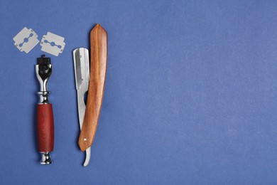 Photo of Set of men's shaving tools on blue background, flat lay. Space for text