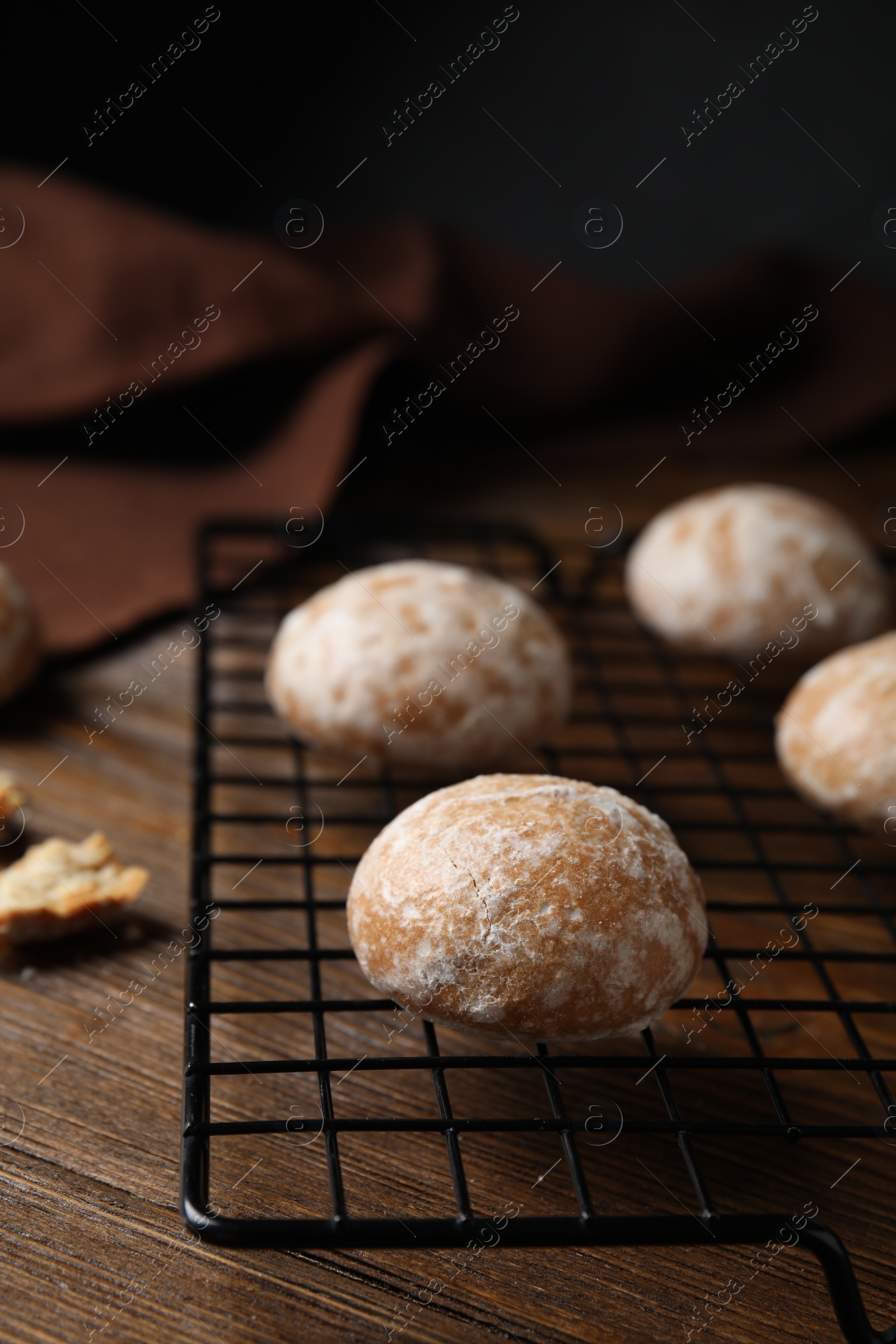 Photo of Tasty homemade gingerbread cookies on wooden table