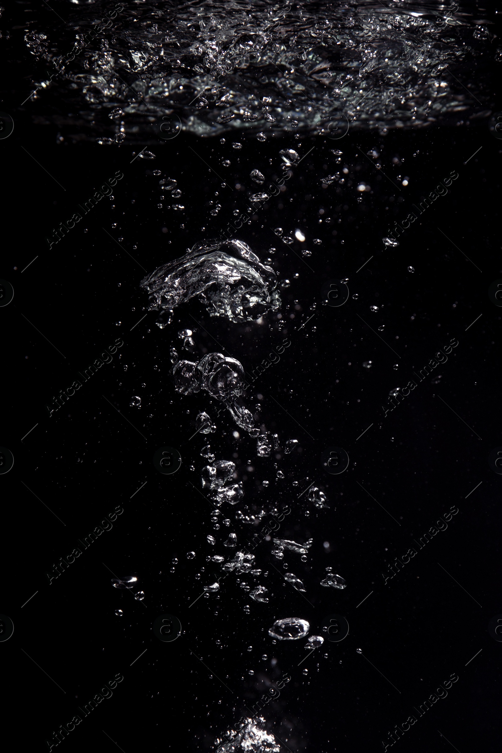 Photo of Air bubbles in water on black background