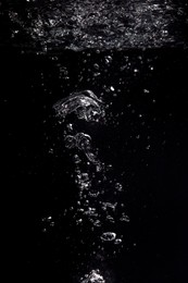 Photo of Air bubbles in water on black background