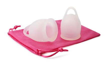 Silicone menstrual cups with pink bag on white background