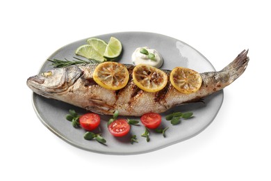 Photo of Plate with delicious baked sea bass fish and garnish on white background
