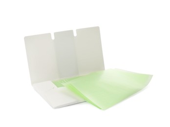 Photo of Package of facial oil blotting tissues on white background. Mattifying wipes