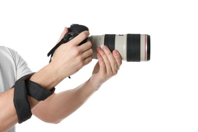 Photo of Photographer holding modern camera on white background, closeup