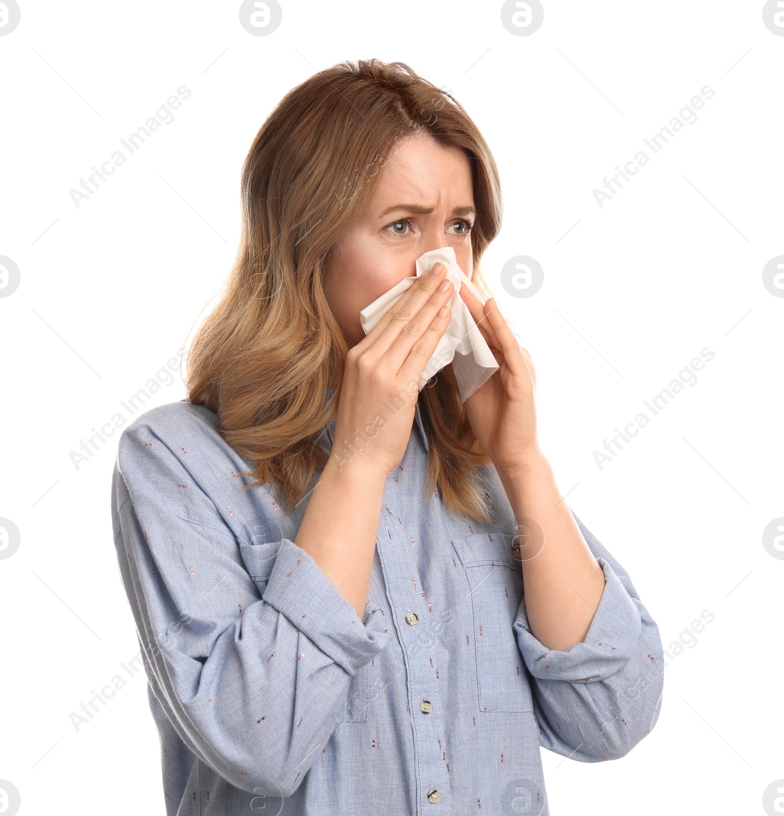 Photo of Woman with tissue suffering from runny nose on white background