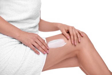 Photo of Woman with smear of body cream on her leg against white background, closeup