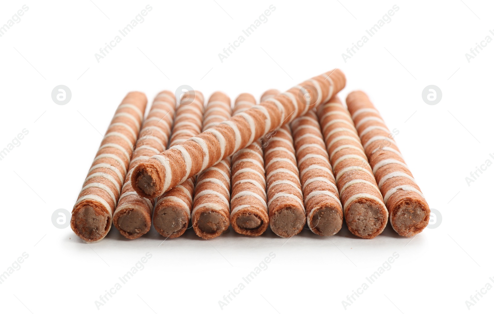 Photo of Delicious chocolate wafer rolls on white background. Sweet food