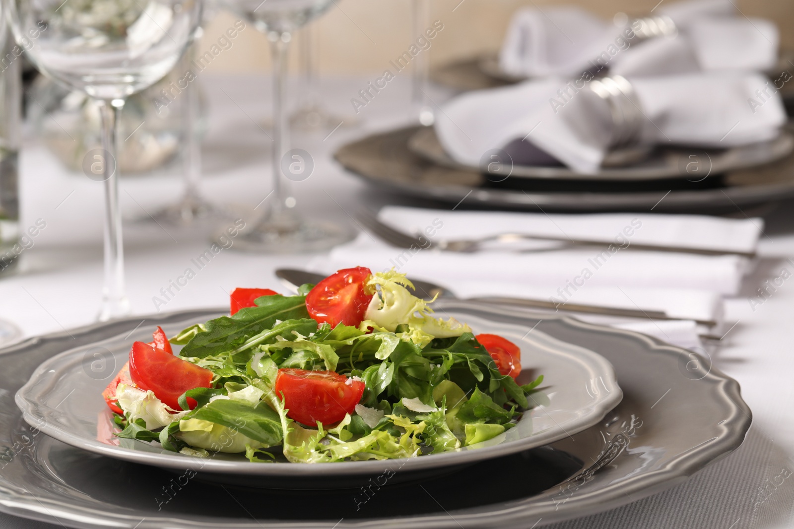 Photo of Delicious salad served on table in restaurant