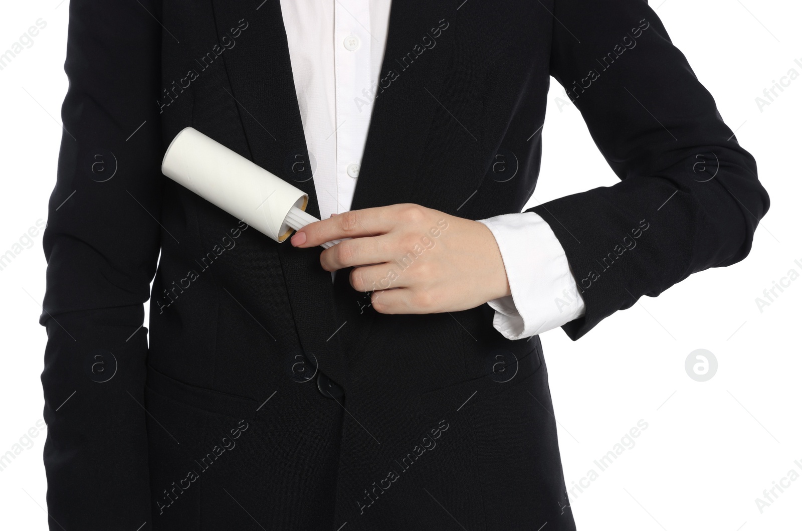 Photo of Woman cleaning suit with lint roller on white background, closeup