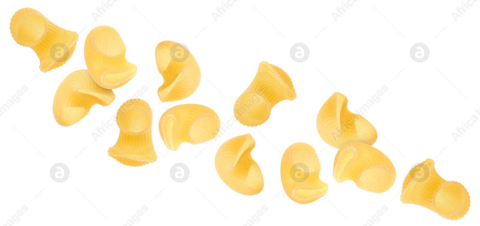 Image of Raw horns pasta flying on white background