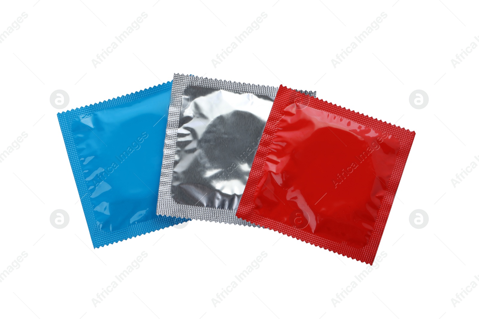 Photo of Condom packages isolated on white, top view. Safe sex