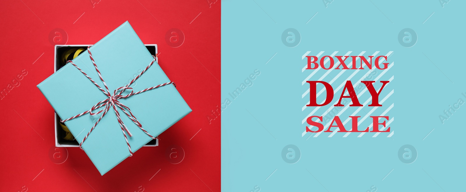 Image of Boxing day sale. Top view of gift on red background, banner design