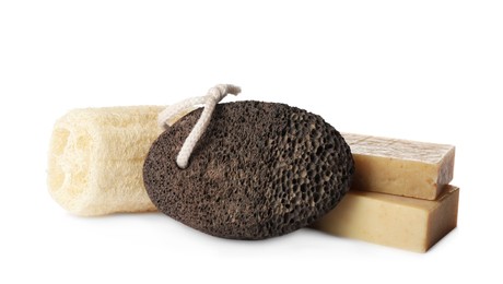 Pumice stone, soap bars and loofah on white background