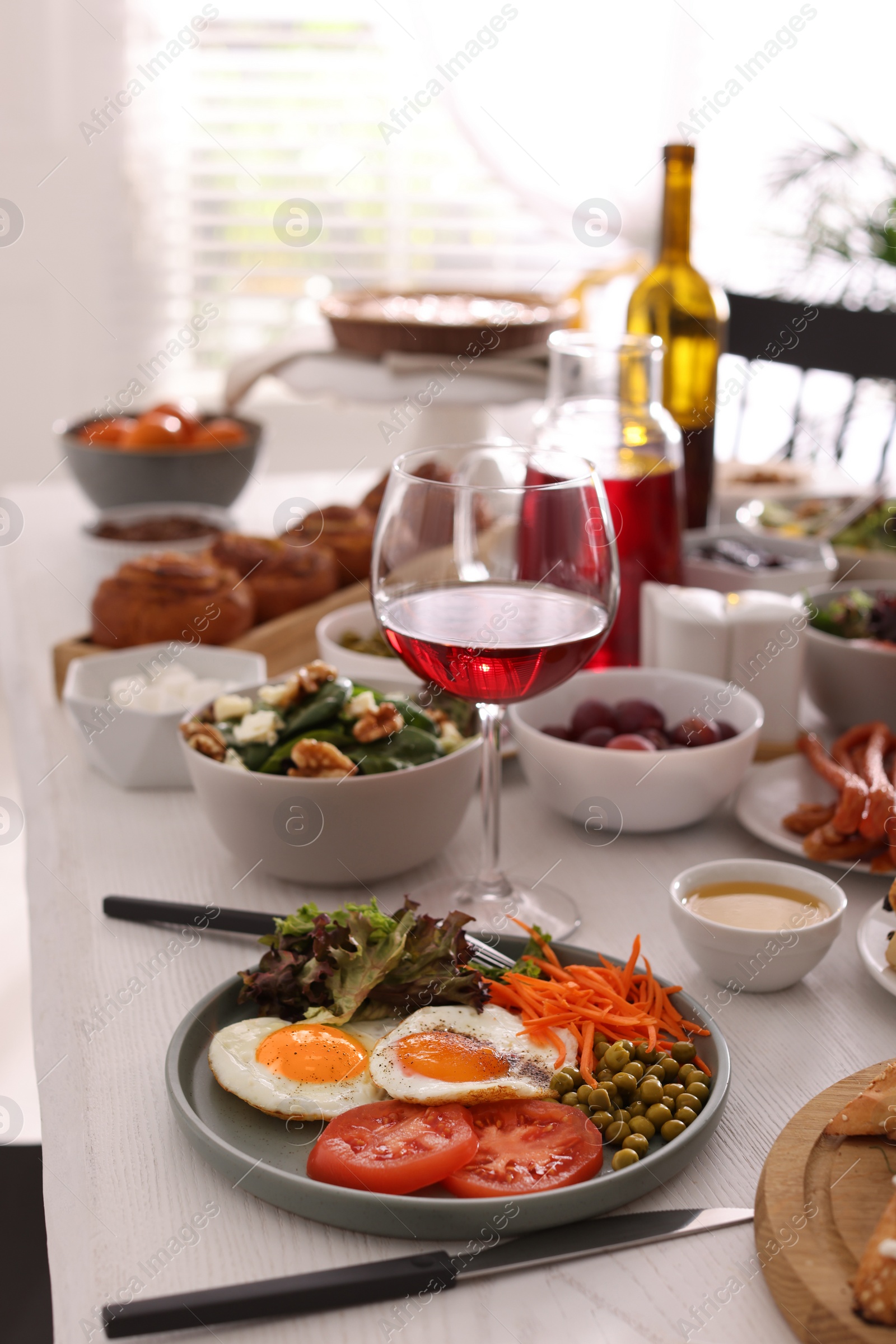 Photo of Many different dishes served on buffet table for brunch