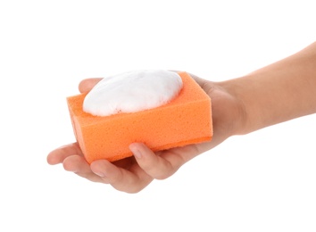 Photo of Woman holding cleaning sponge with foam for dish washing on white background, closeup