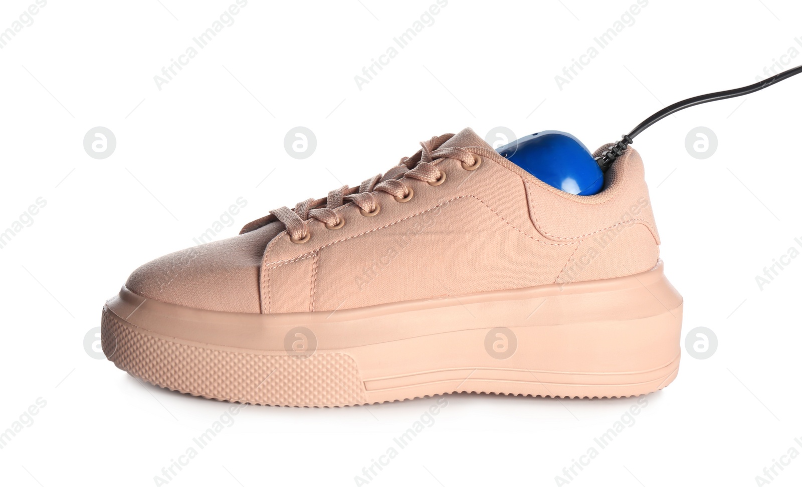 Photo of Stylish shoe with modern electric footwear dryer on white background