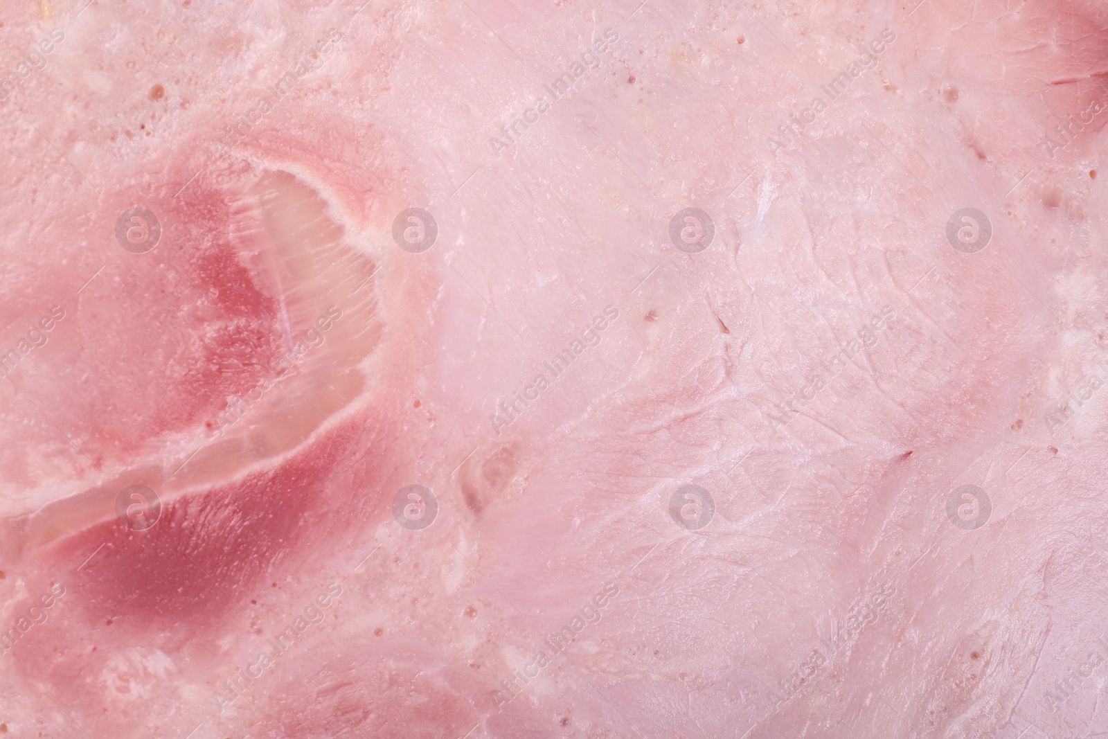 Photo of Closeup view of tasty fresh ham. Meat product