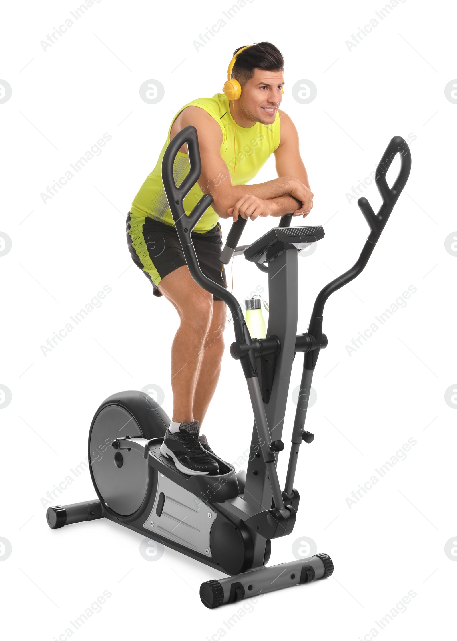 Photo of Man using modern elliptical machine on white background