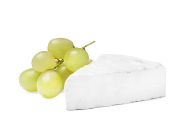Photo of Tasty brie cheese with grapes on white background