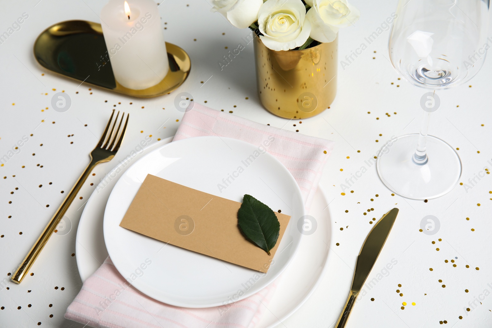 Photo of Elegant festive table setting with blank card on white background