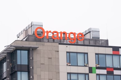 Warsaw, Poland - September 10, 2022: Building with modern Orange logo