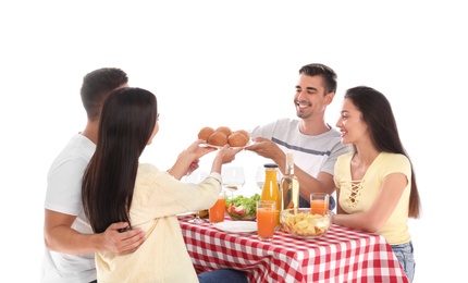 Group of friends at picnic table against white background