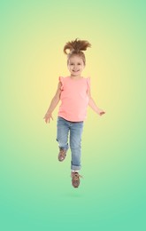 Image of Happy cute girl jumping on color gradient background