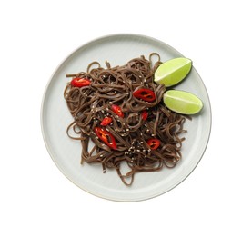 Photo of Tasty buckwheat noodles (soba) with chili pepper, sesame and lime isolated on white, top view