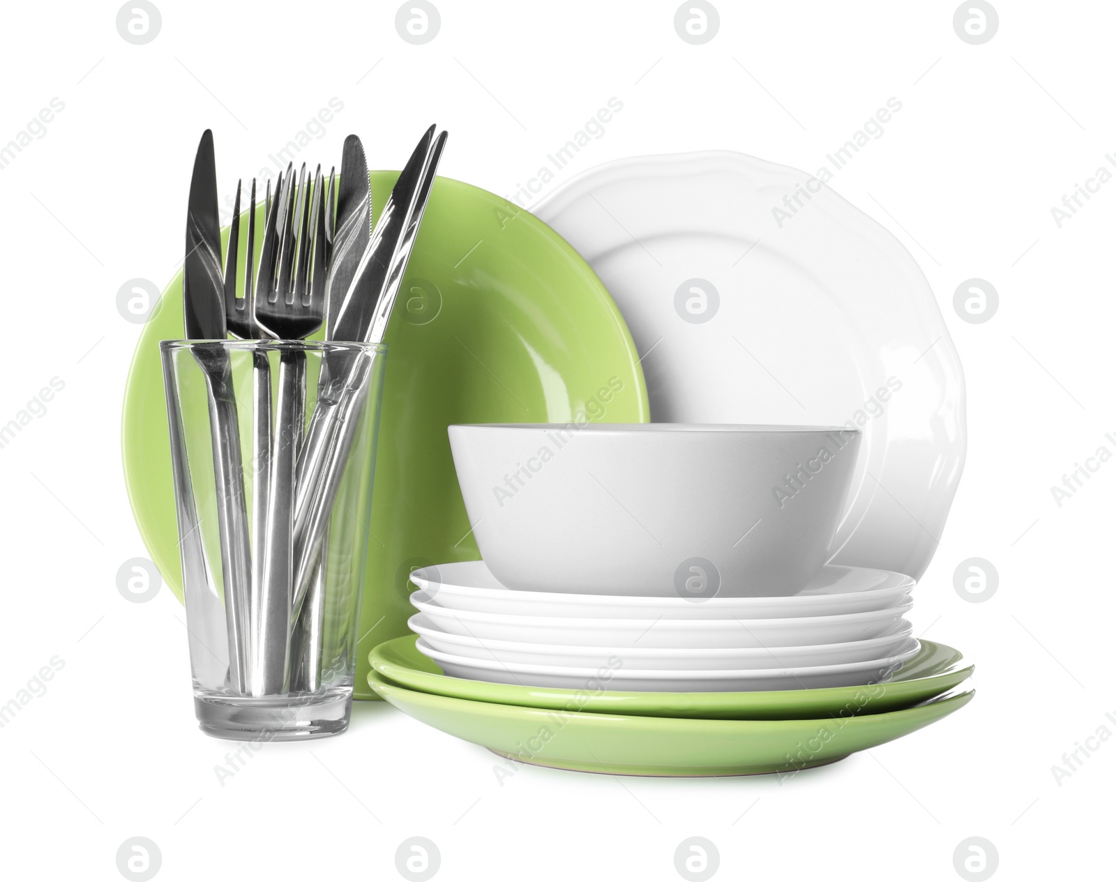 Photo of Set of beautiful ceramic dishware, glass and cutlery isolated on white