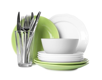 Set of beautiful ceramic dishware, glass and cutlery isolated on white