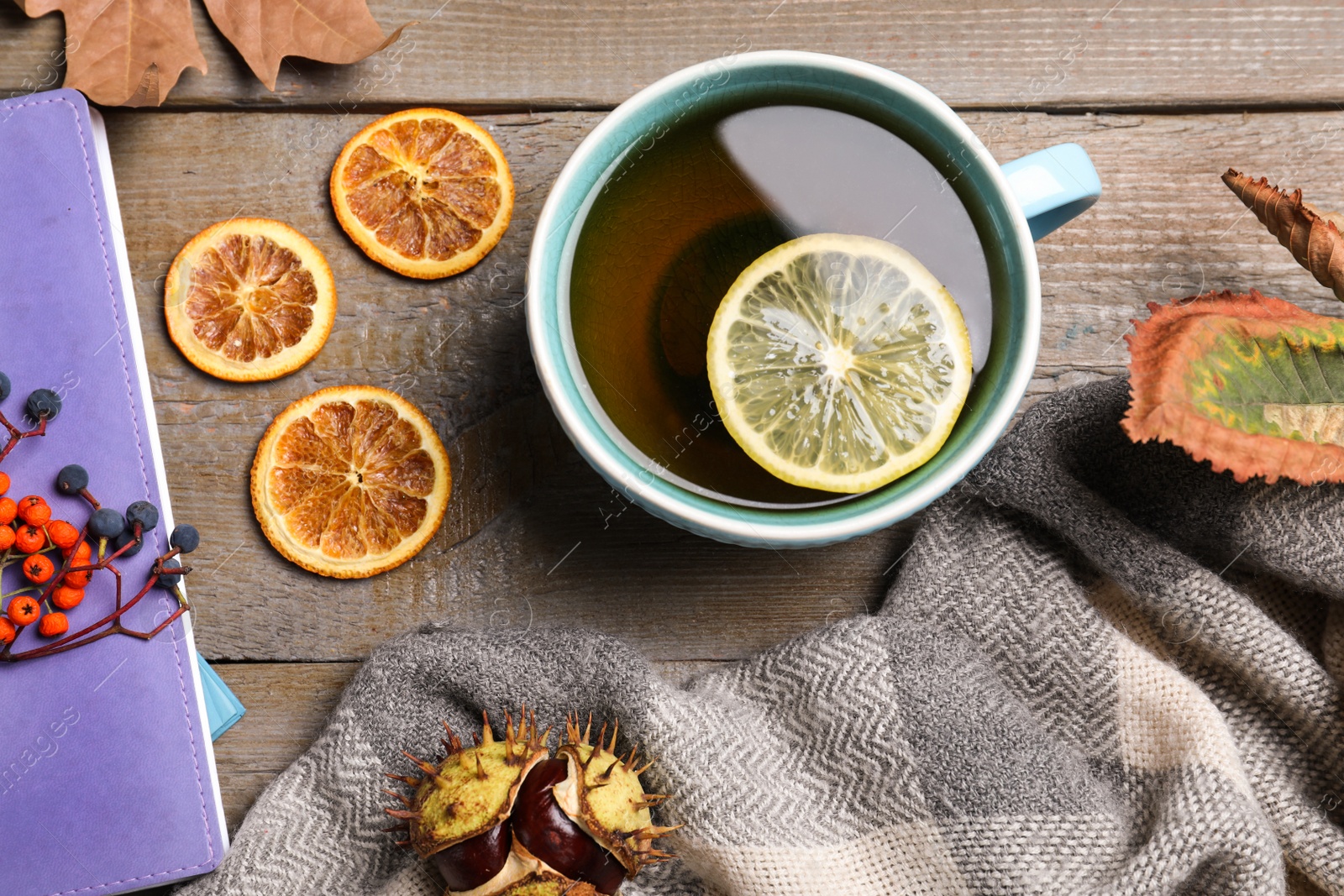 Photo of Flat lay composition with cup of hot drink on wooden table. Cozy autumn atmosphere