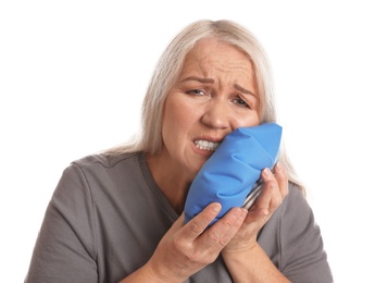 Photo of Mature woman suffering from toothache on white background