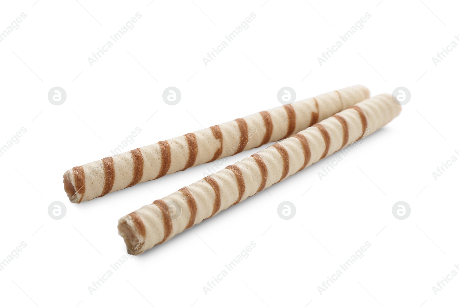 Photo of Tasty wafer roll sticks on white background. Crispy food