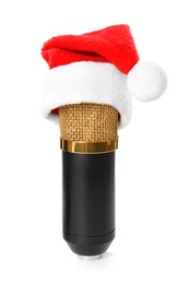 Photo of Microphone with Santa hat isolated on white. Christmas music