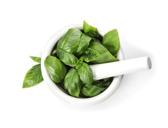 Photo of Mortar with fresh green basil leaves on white background, top view