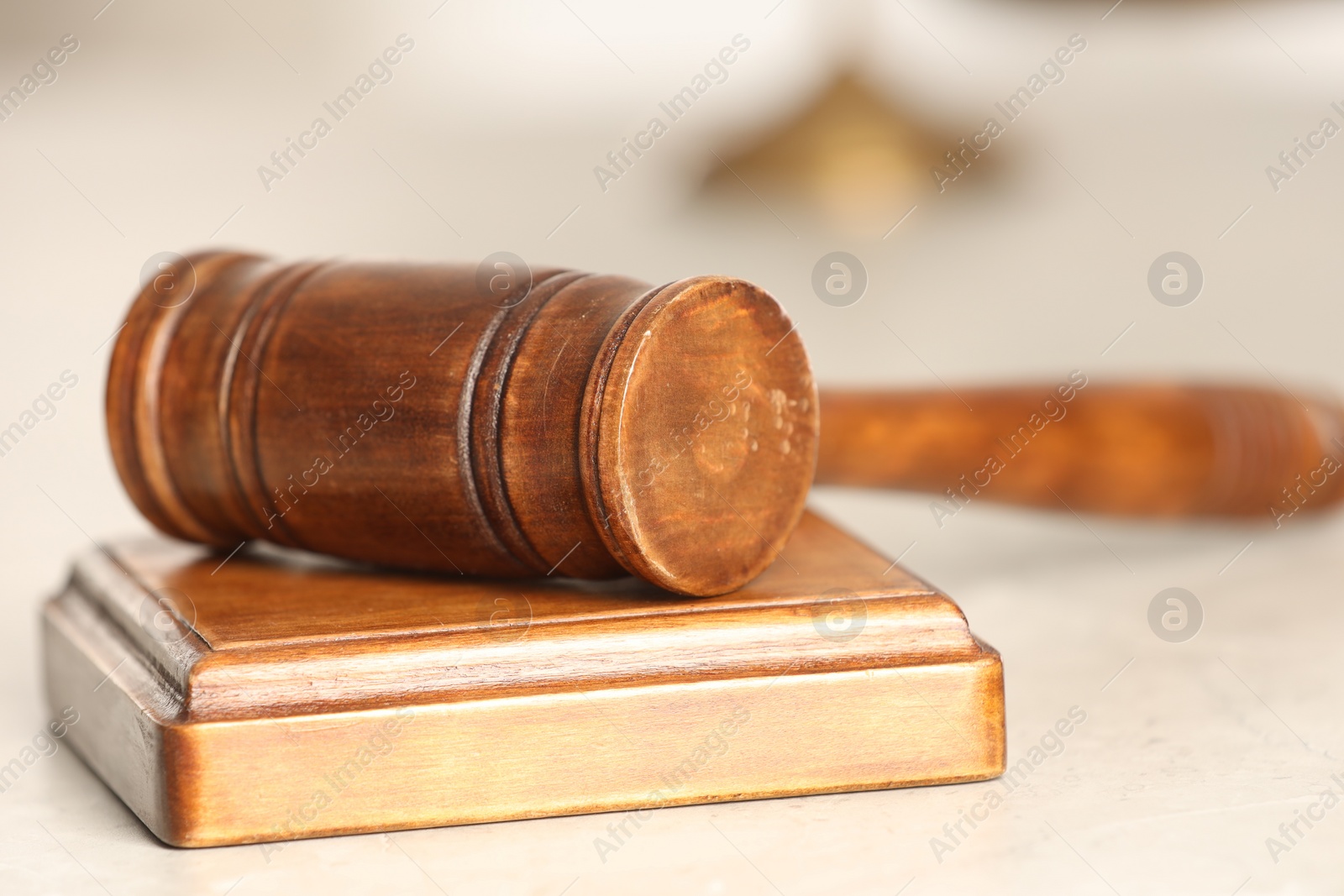 Photo of Law concept. Gavel and sound block on white table, closeup