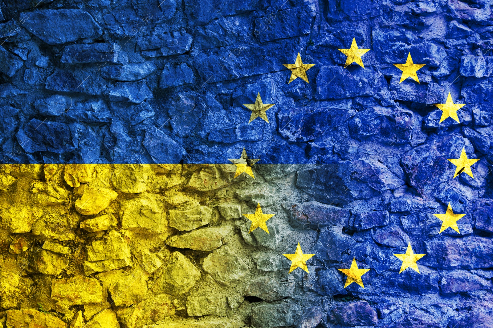 Image of Flags of Ukraine and European Union on stone wall. International diplomatic relationships