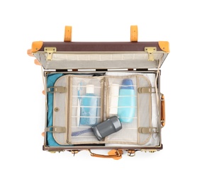 Photo of Packed suitcase with deodorant and body hygiene kit on white background, top view