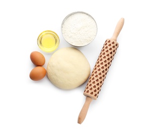 Photo of Raw dough and ingredients on white background, top view