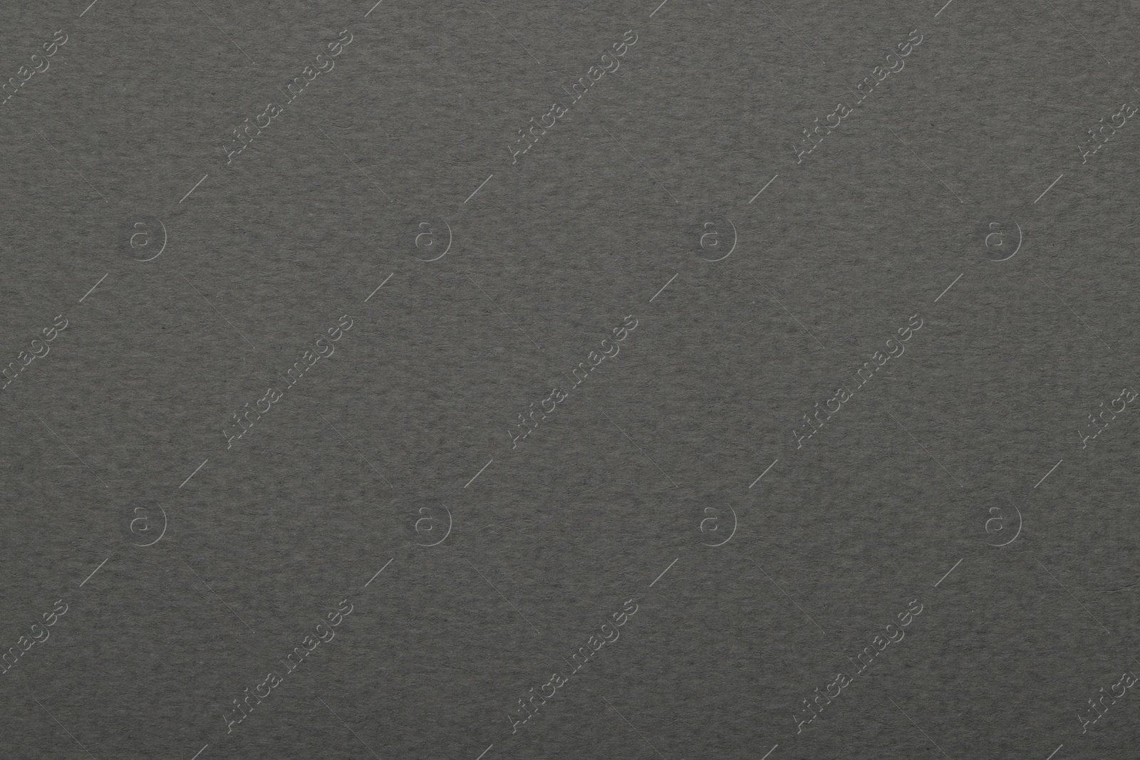 Photo of Texture of grey paper sheet as background, top view