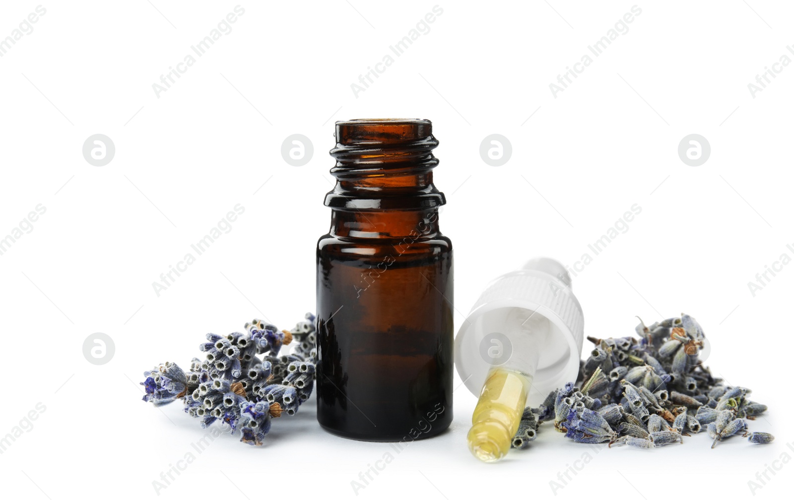 Photo of Bottle of essential oil and flowers on white background