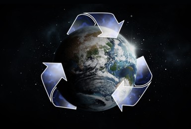 Image of Illustration of recycling symbol and Earth on dark background