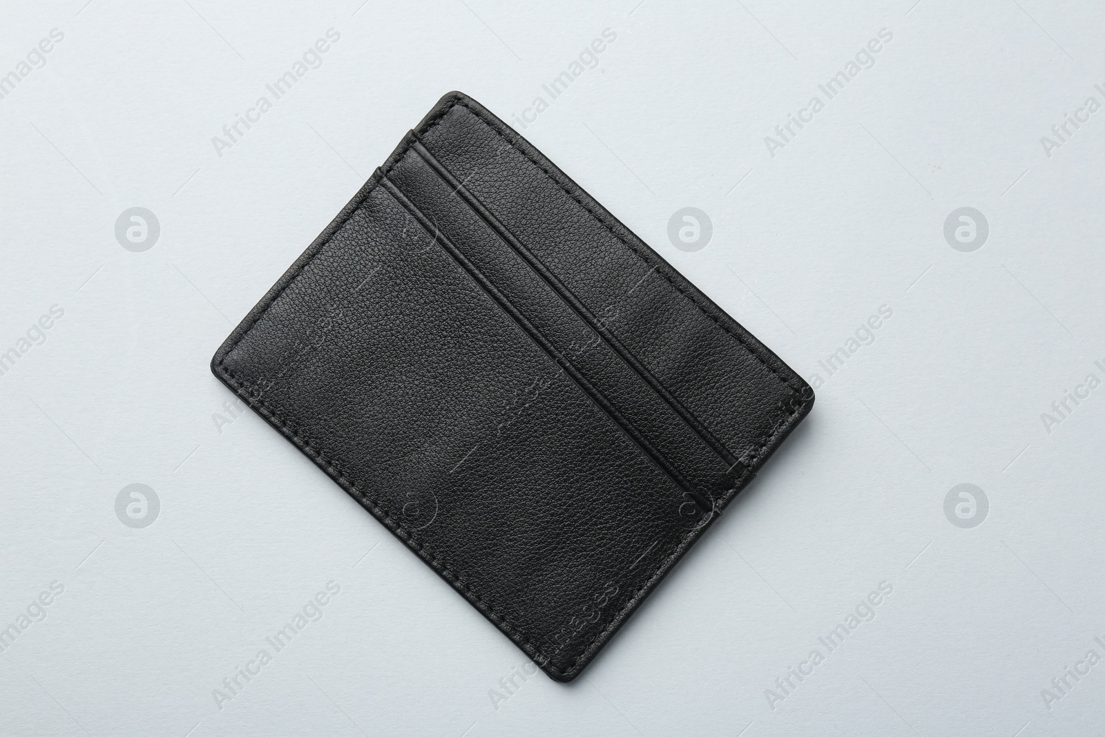 Photo of Empty leather card holder on light grey background, top view