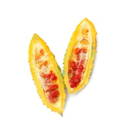 Photo of Halves of ripe bitter melon on white background, top view