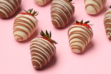 Photo of Delicious chocolate covered strawberries on pink background, closeup