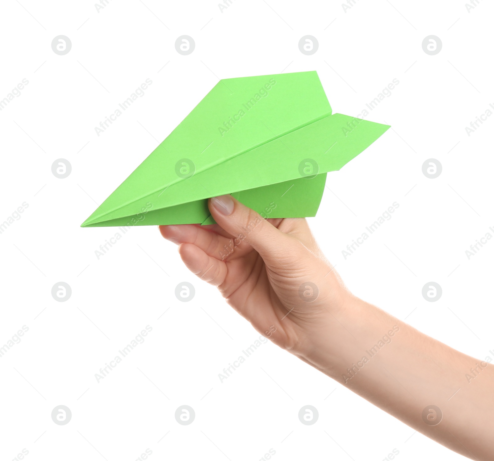 Photo of Woman holding green paper plane on white background, closeup