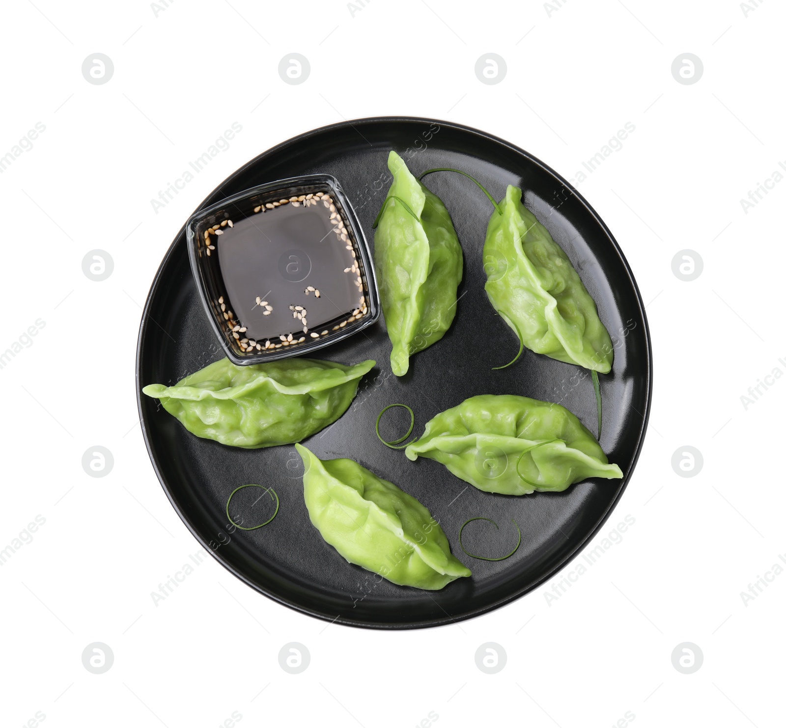 Photo of Delicious green dumplings (gyozas) and soy sauce isolated on white, top view