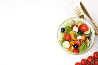 Tasty fresh Greek salad on white background, top view