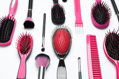 Photo of Composition with hair combs and brushes on white background